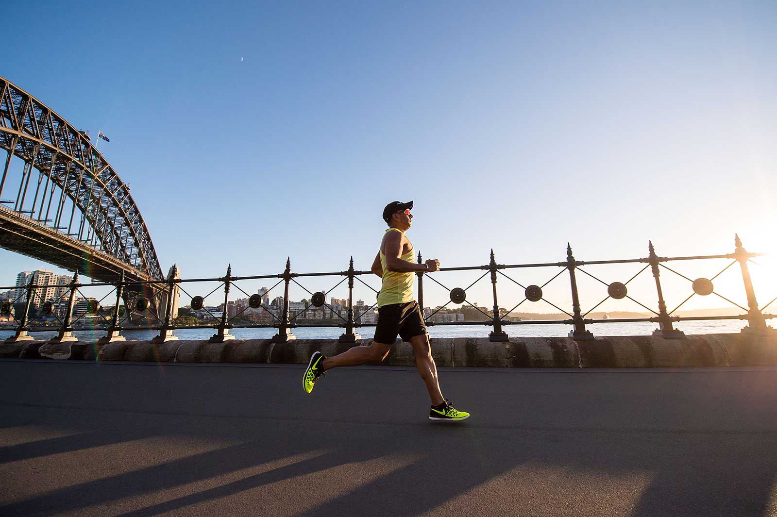 Man jogging near Sydney harbar bridge