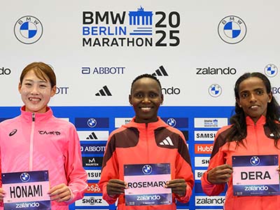 Rosemary Wanjiru, Dera Dida and Honami Maeda with their runner bibs