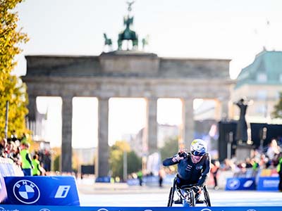 Marcel Hug celebrates winning another Berlin Marathon
